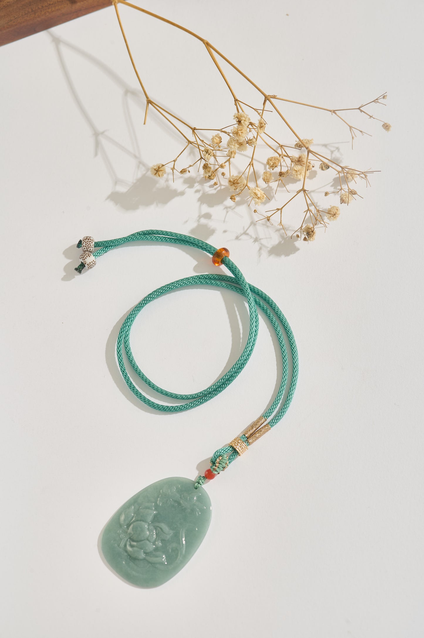 Lotus Serenity – Hand-Carved Jade Pendant Necklace with Silk Cord & Gold Details