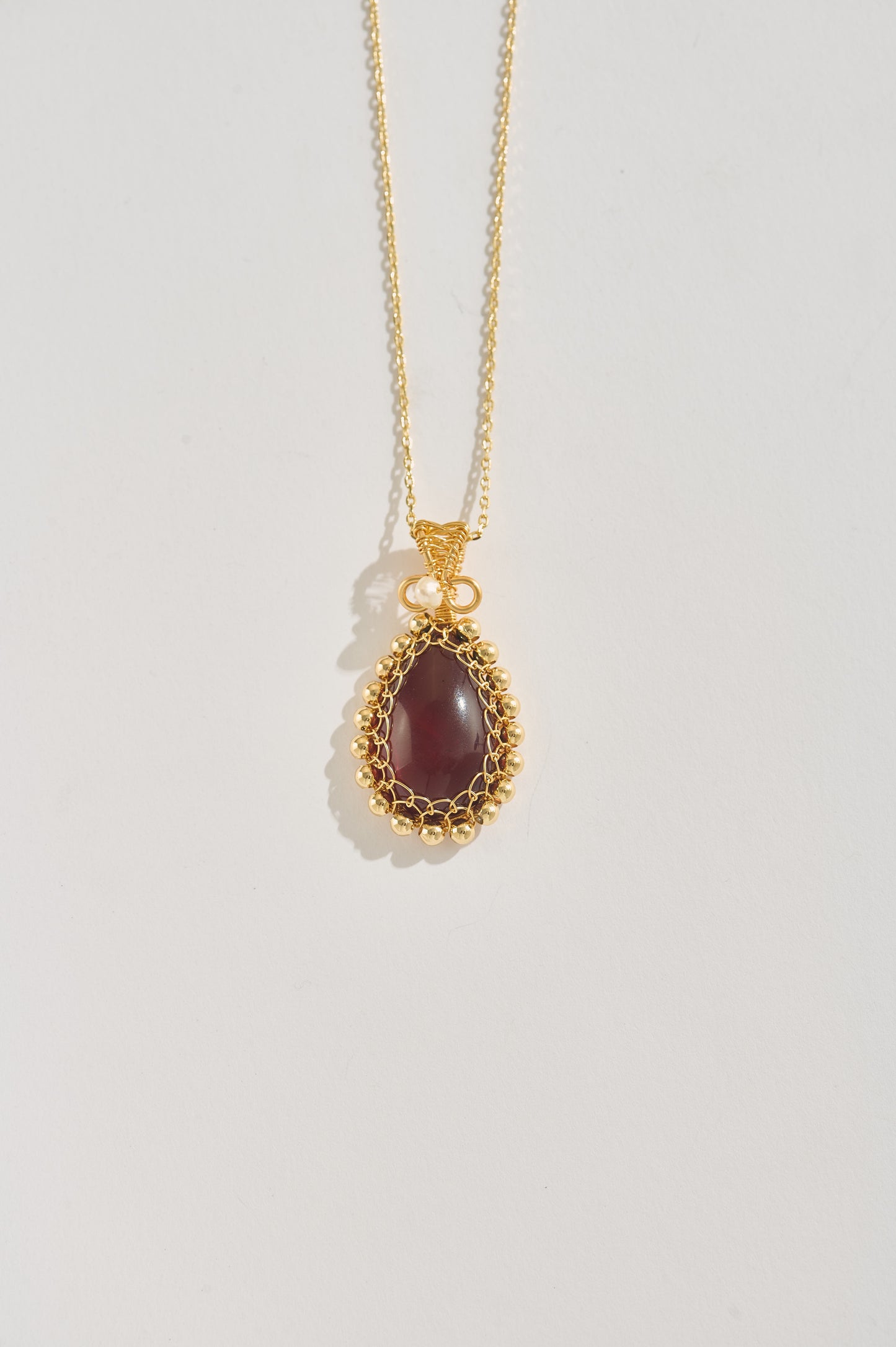 Imperial Glow – Blood Amber Pendant Necklace with Gold Filigree & Pearl Accent